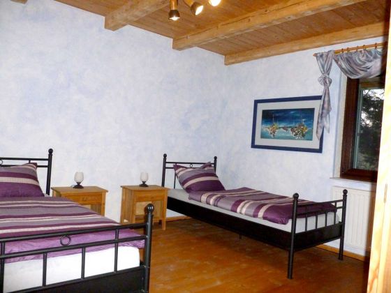Ferienwohnung Schlafzimmer mit zwei Betten